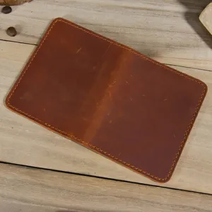 Handmade genuine leather mini card holder detail, featuring retro texture and durable stitching.