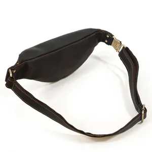 Detailed view of the vintage genuine leather waist bag, showing strap and metal buckle.