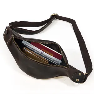 Detail view of the brown vintage genuine leather chest bag interior capacity with zipper.