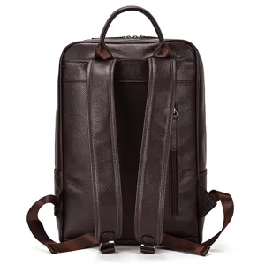 Detailed view of the dark brown genuine leather backpack showing durable straps and back texture.