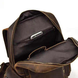 Vintage crazy horse leather backpack interior detail with secure zipper pocket.
