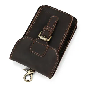 Genuine leather phone holster detail showing vintage crazy horse texture and brass hardware buckle.