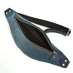 Detail view of the vintage blue genuine leather waist bag, showing metal zippers and interior.