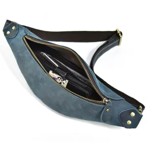 Detail view of the vintage genuine leather waist bag showing interior compartment and zipper.