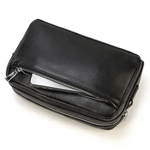 Sac pochette pour homme en cuir véritable noir multifonction avec poche zippée avant.