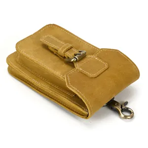 Genuine leather retro waist bag with metal buckle, durable belt pouch for men, close-up view.