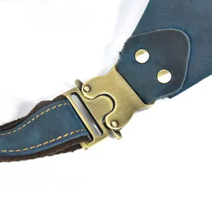 Detailed shot of retro genuine leather bag strap, brass quick release buckle and sturdy rivets.