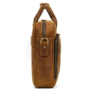 Men vintage genuine leather briefcase side detail view, business laptop handbag commuter bag.