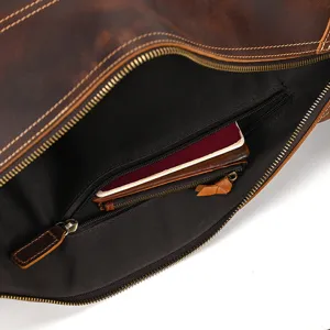 Detailed view of genuine leather chest bag interior zipper pocket and storage compartment.