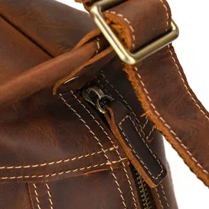 Vintage crazy horse leather chest bag detail, premium cowhide crossbody bag texture and hardware.