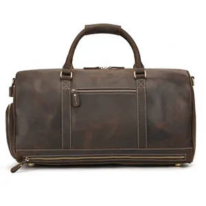 Leather travel duffel bag detail showing retro design, sturdy handles and spacious compartment.