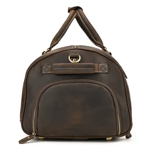 Vintage crazy horse leather travel duffel bag with front zipper pocket and sturdy top handles.