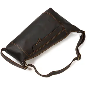 Detailed view of vintage brown crazy horse leather men chest bag, durable metal zippers and strap.