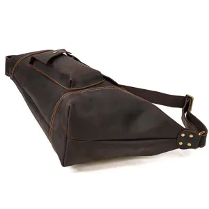 Detailed close-up of the vintage brown crazy horse leather sling bag showing durable stitching.