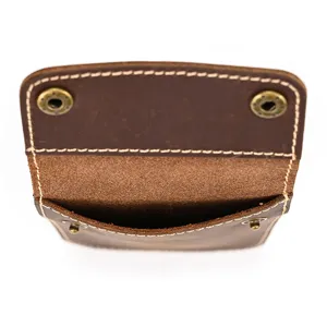 Detailed close-up view of vintage crazy horse leather watch pouch with snap button.