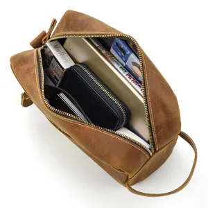 Detail view of retro genuine leather toiletry bag, showing large capacity and multiple pockets.