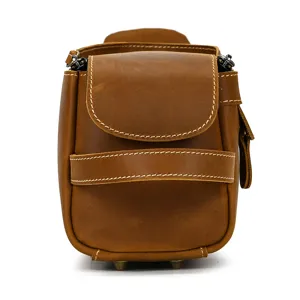 Close-up detail of vintage crazy horse leather toiletry bag, premium stitching and metal feet.