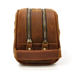Vintage crazy horse leather toiletry bag detail, brown cowhide double zipper cosmetic organizer.