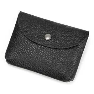 Leather snap coin purse close-up view displaying genuine cowhide leather texture.