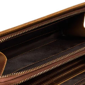 Detail view of vintage crazy horse leather long wallet interior with card slots and metal zipper.