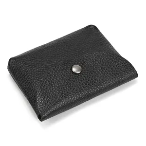 Black genuine leather coin purse detail, pebbled texture cowhide with snap closure.