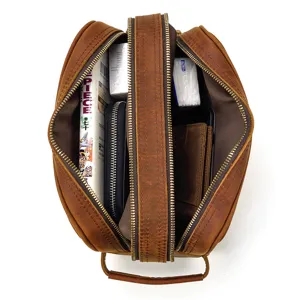 Detailed top-down view of a genuine crazy horse leather travel toiletry and makeup organizer bag.