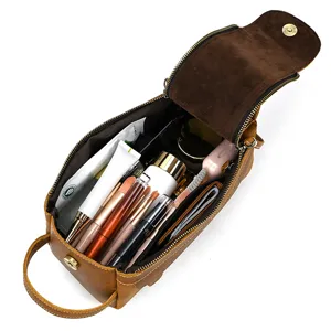 Detail view of the vintage genuine leather cosmetic bag showing spacious interior compartments.