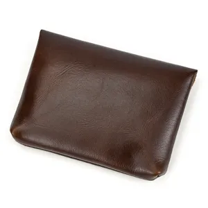 Close up view of the genuine leather dark brown snap coin purse showcasing fine texture details.