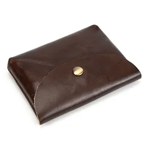 Close-up detail view of the dark brown genuine leather snap coin purse and card holder.