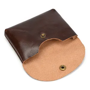 Detailed view of genuine leather snap coin purse, premium cowhide card holder for daily use.