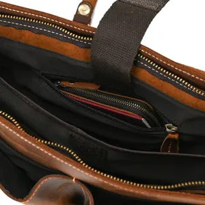 Men's vintage crazy horse leather briefcase interior detail showing zippers and compartments.