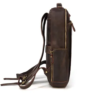Side view detail of vintage genuine leather backpack showcasing fine stitching and metal zippers.