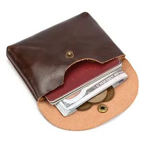 Genuine leather snap coin purse cowhide card bag detail view showing interior storage capacity.