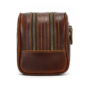 Vintage genuine leather toiletry bag with double zippers, retro brown cosmetic storage pouch.