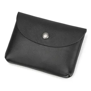 Close-up detail of black genuine leather snap coin purse and card holder for men and women.