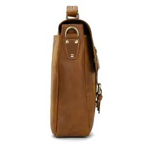 Side detail view of vintage brown leather men briefcase showing durable stitching and hardware.