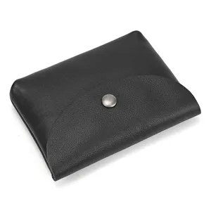 Black leather coin purse with snap closure, premium cowhide card holder detail view.