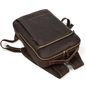 Close-up detail view of vintage brown leather laptop backpack for men, daily business bag.