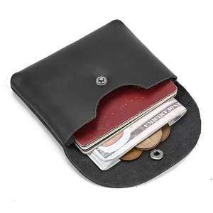 Detailed view of genuine leather snap coin purse showcasing card and cash storage capacity.