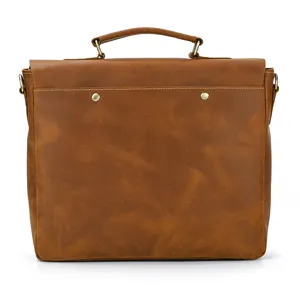 Leather briefcase detail shot showcasing vintage brown crazy horse leather and metal hardware.