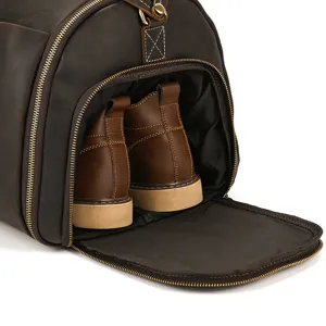 Vintage leather travel duffel bag with separate shoe compartment for men and women.