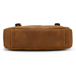 Detail view of men's vintage crazy horse leather briefcase bottom and stitching.