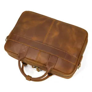 Vintage leather briefcase detail showing premium texture, sturdy stitching and strong metal zippers.