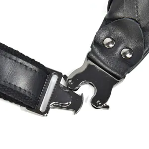 Close-up detail of black genuine leather bag strap with metal quick-release buckle.