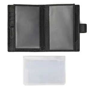 Detailed view of black leather passport wallet interior showing transparent slots and removable sleeve.