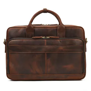 Detail view of men's vintage genuine leather briefcase business laptop bag with dual handles.