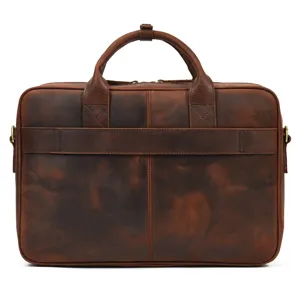 Detail view of men's genuine leather briefcase, retro business laptop bag with dual top handles.