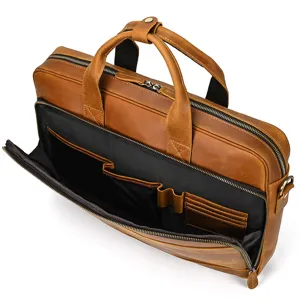 Detail view of the brown leather business briefcase showing interior laptop compartments.