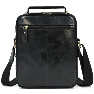 Men leather shoulder bag detail showing genuine cowhide texture and metal hardware.