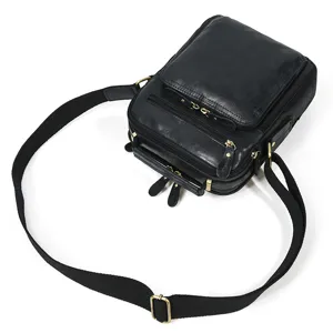 Men genuine leather shoulder bag detail view, black cowhide crossbody bag with multi pockets.